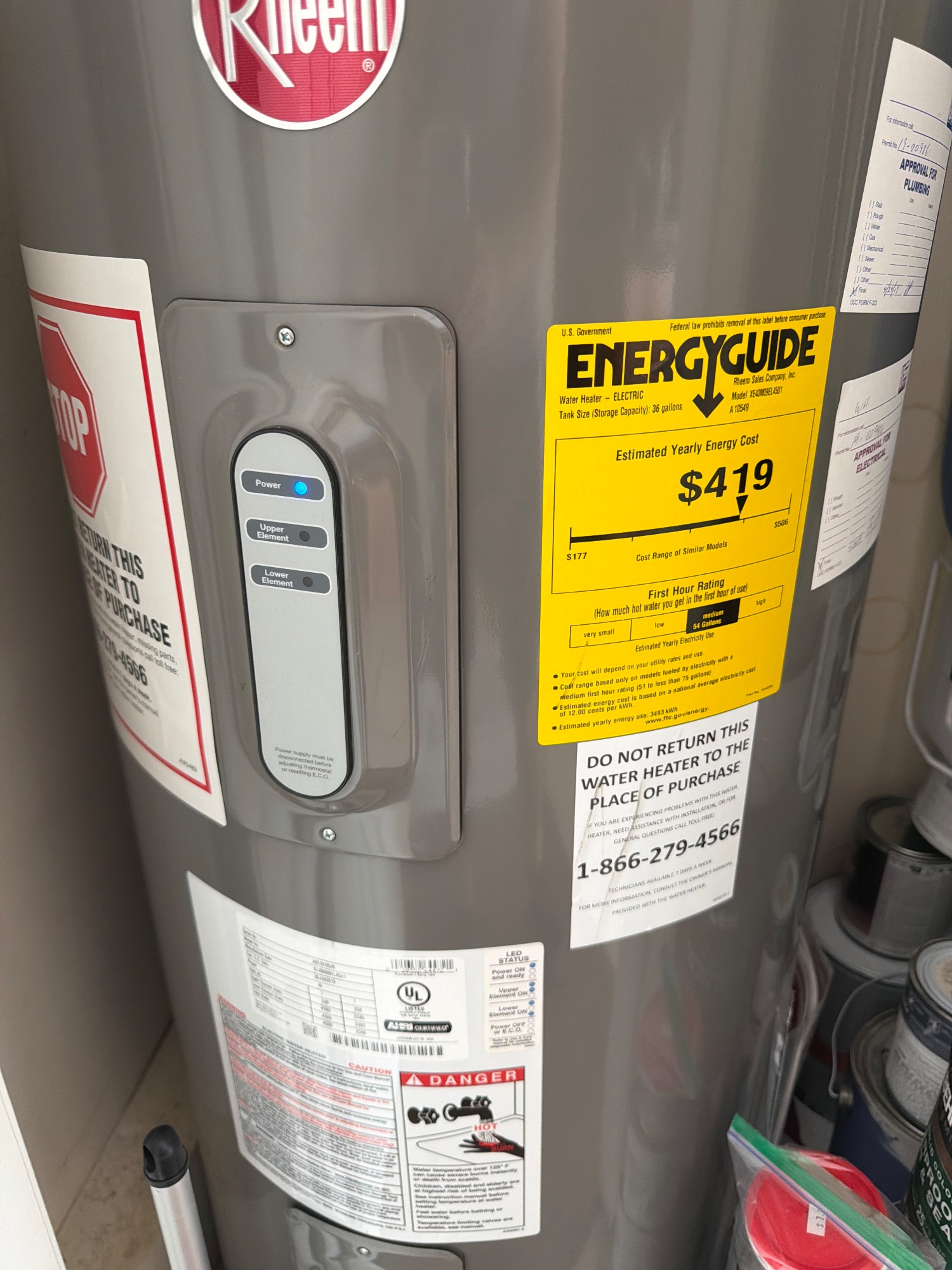 The water heater, close enough to read its label