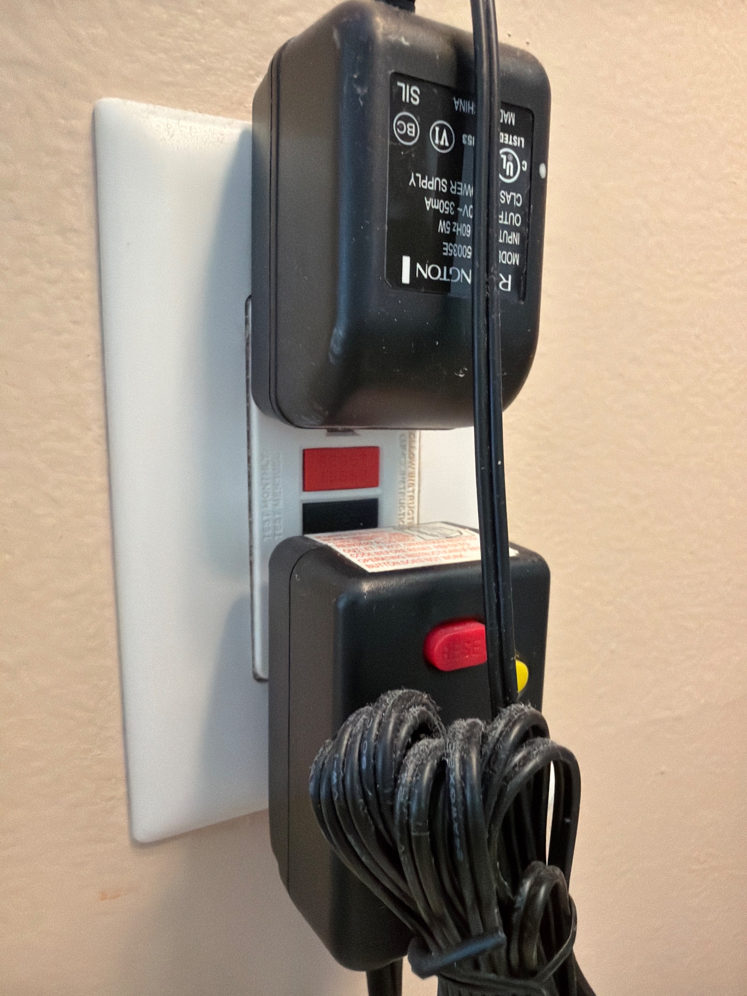 Any outlet, close enough to read whether it has small TEST and RESET buttons