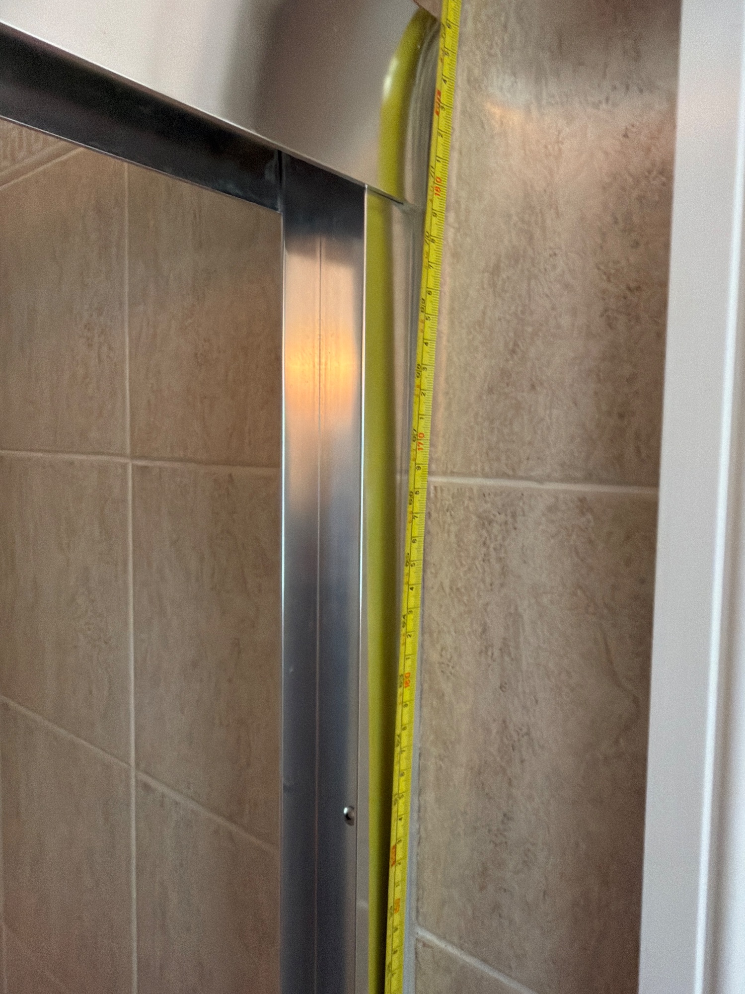 Tape in place: Floor to the top of the tub wall or shower curb
